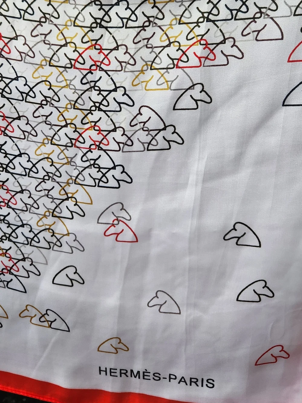 Hermès White Scarf with Red, Black, Gold and Gray Motif